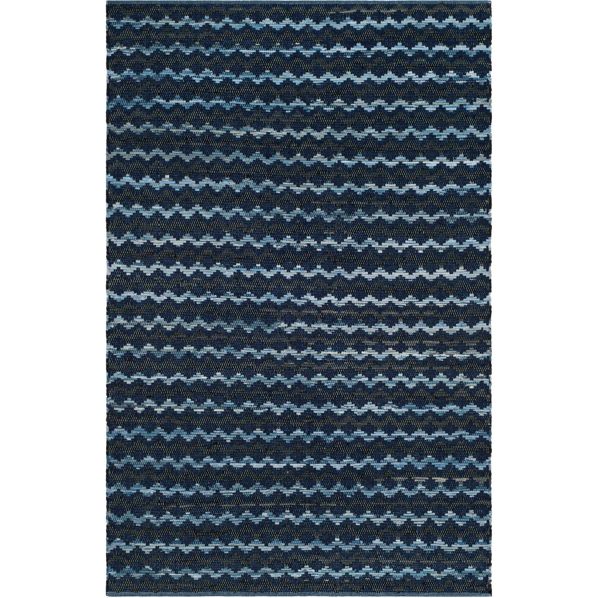 Navy and black cotton rug with soft blue wave bands and a low, textured profile