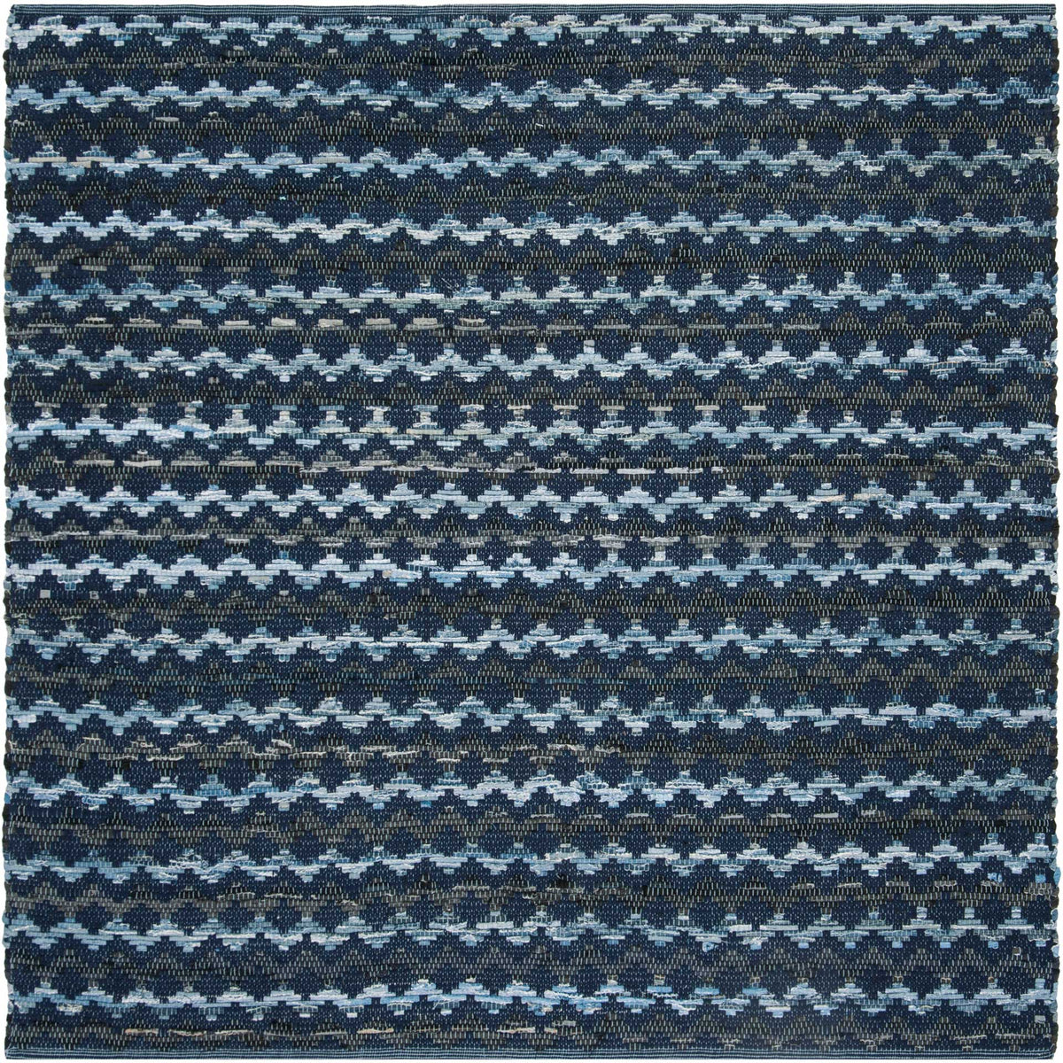 Square navy cotton rug layers light blue zigzags over dense black and blue threads