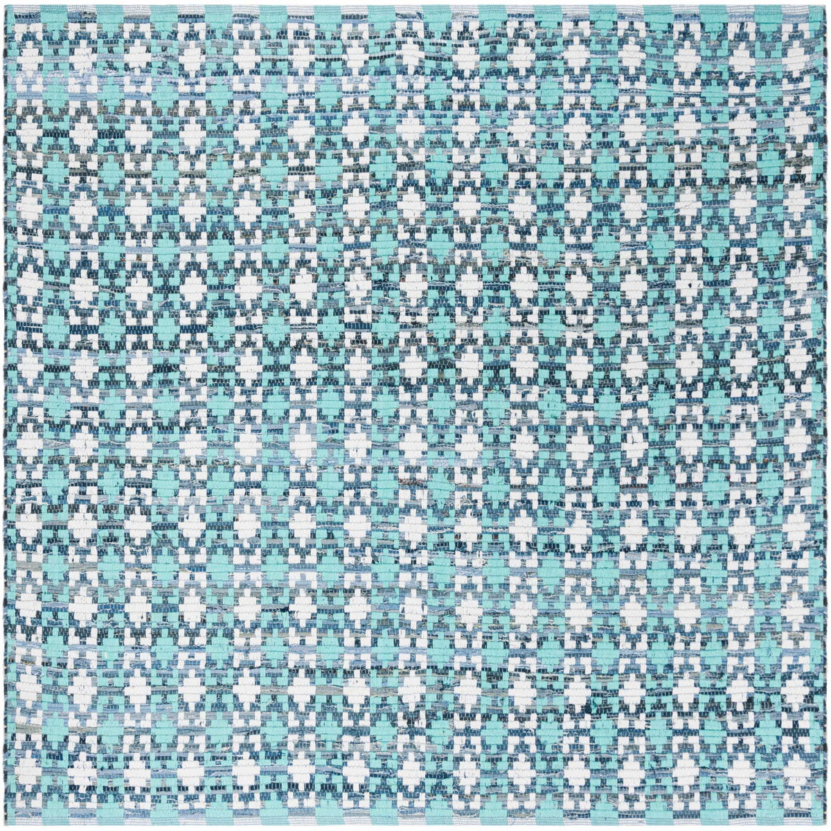 Square cotton rug blends turquoise, ivory, and dark blue shapes into a bright geometric design
