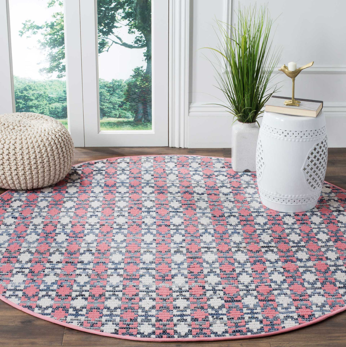 Coral and blue round rug brings lively geometric pattern to a light-filled space