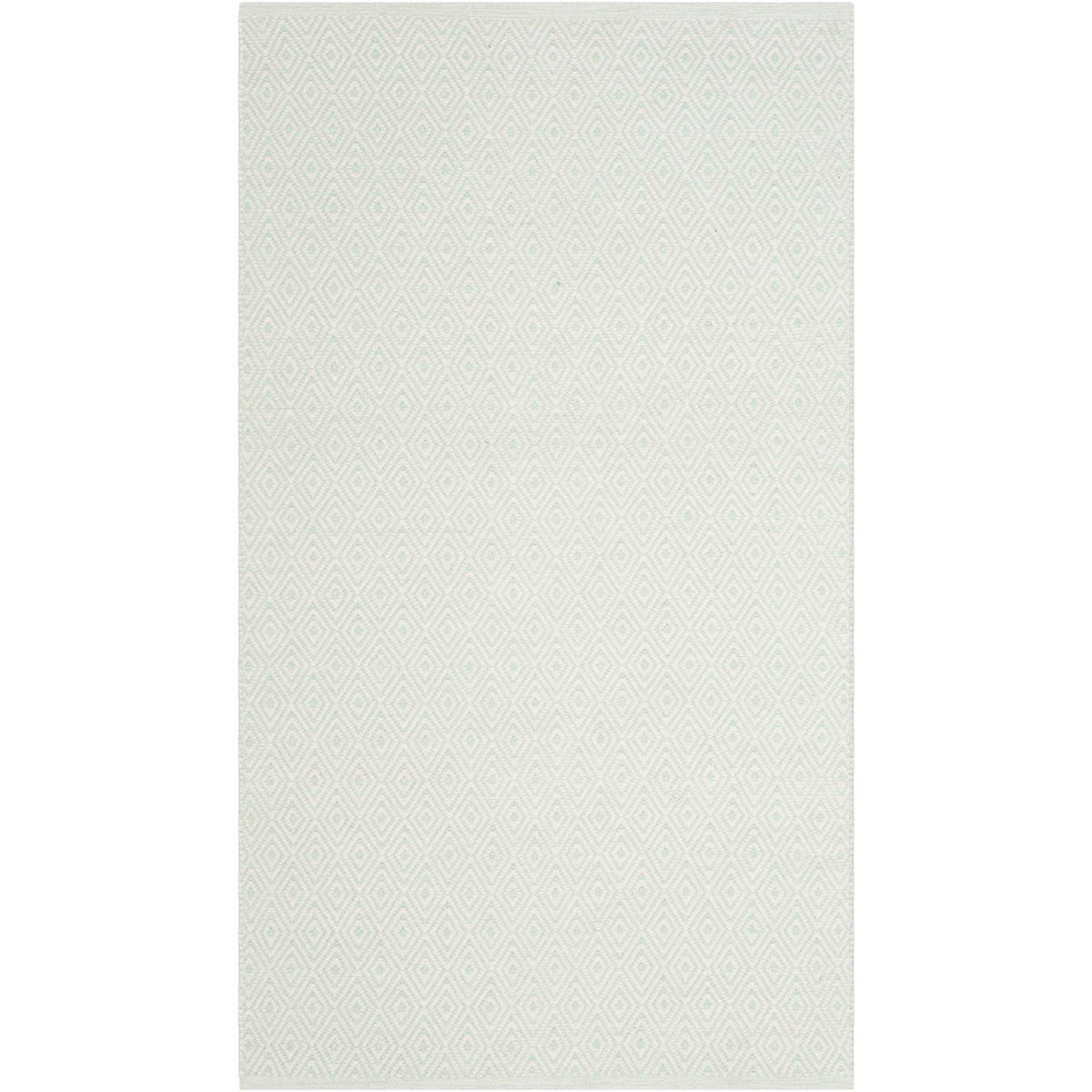 Light ivory and foam green diamonds lend gentle texture to a compact cotton rug