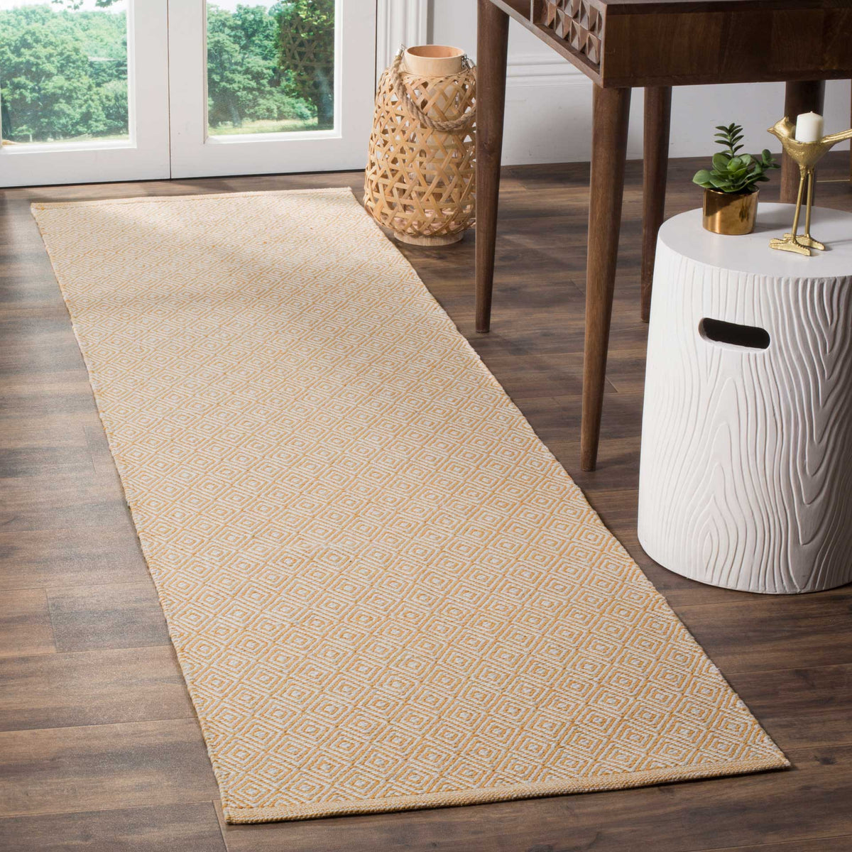 Warm gold diamonds add a subtle geometric rhythm to this slim ivory runner