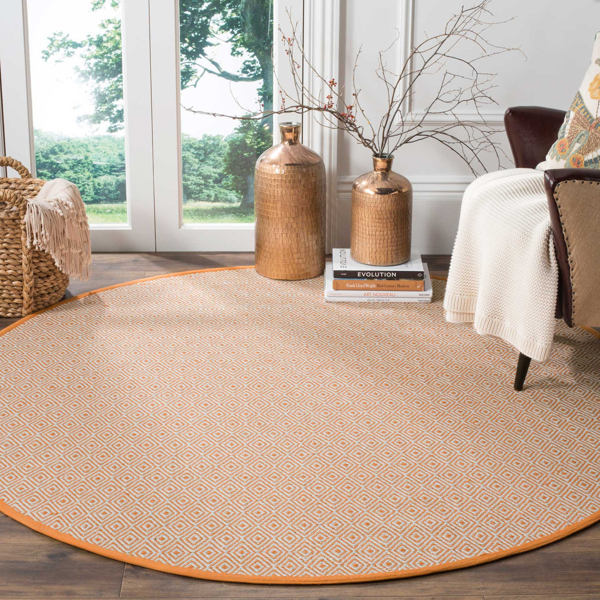 Warm rust and ivory diamonds enliven a living area with a soft cotton foundation.