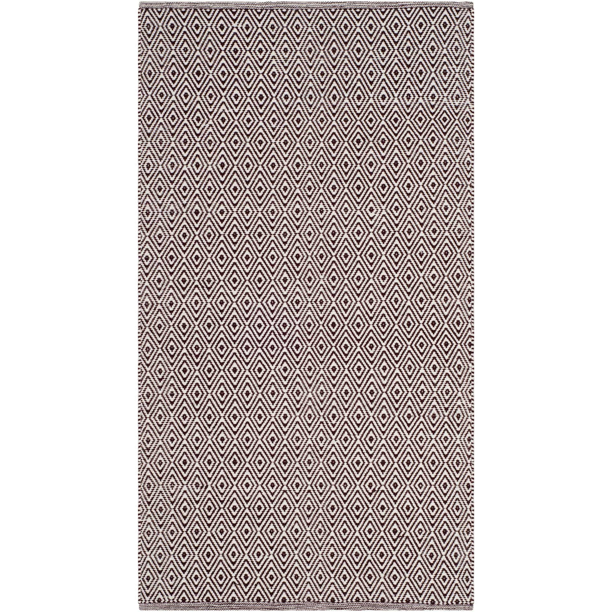 Ivory and chocolate rug brings a high-contrast diamond pattern to smaller spaces