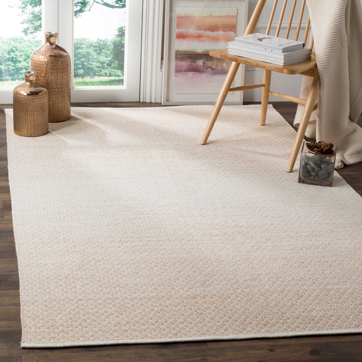 A soft beige and ivory diamond weave grounds the space with a pale, airy center.