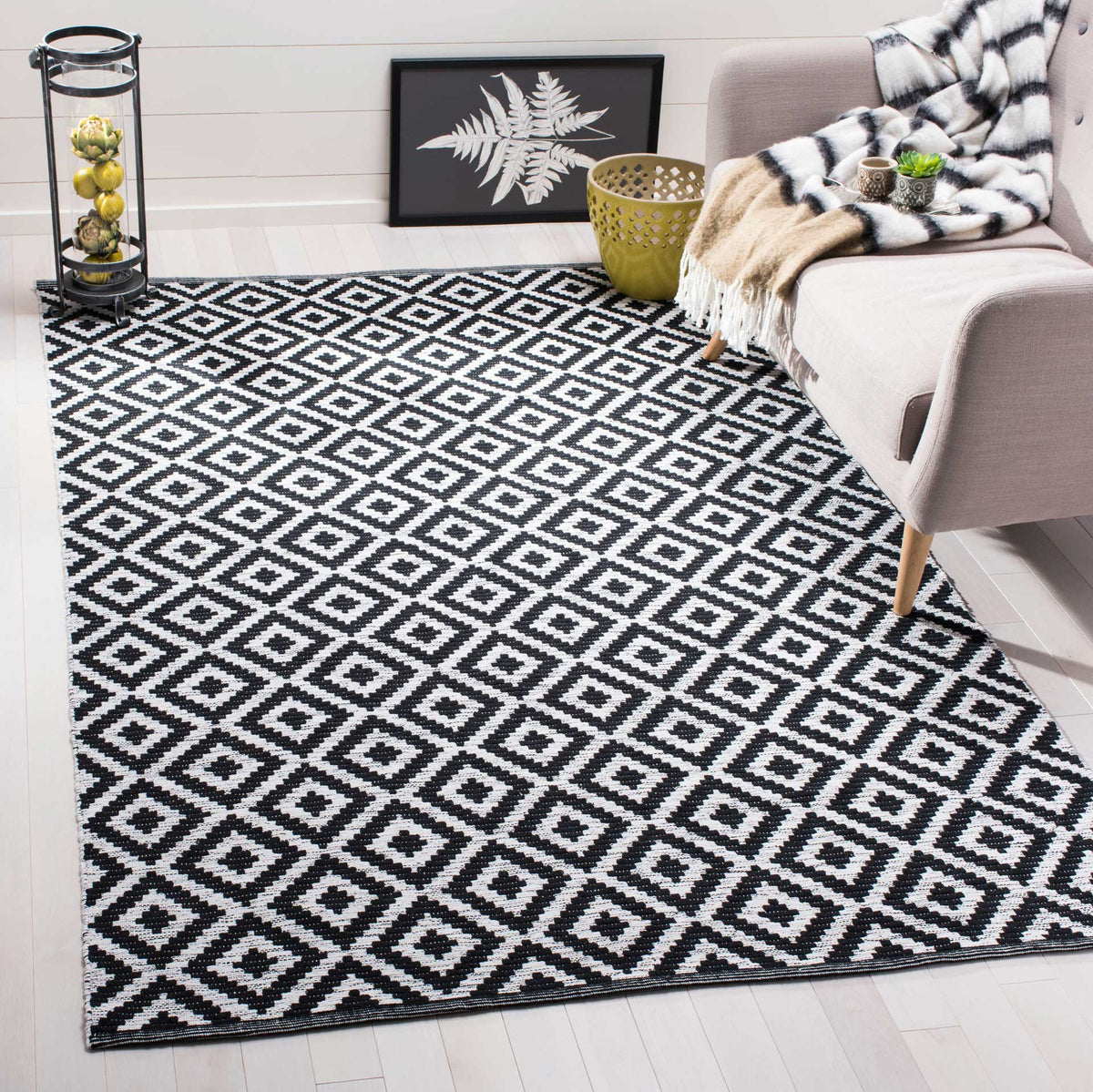 Black and ivory diamonds give a bright seating area a modern focal point.