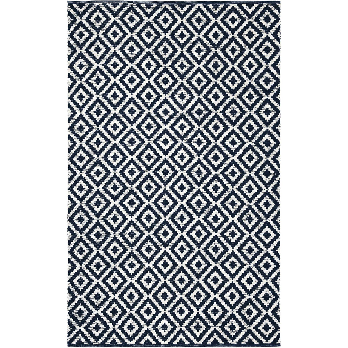 A repeating navy-and-ivory diamond pattern gives this cotton rug graphic appeal.