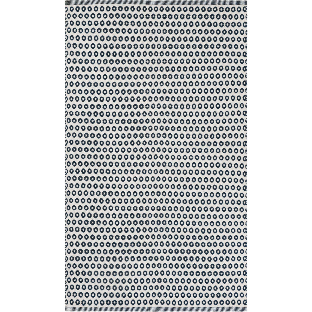 Ivory rug with densely spaced navy rings and a crisp rectangular silhouette