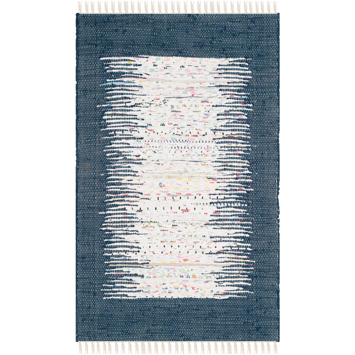 A petite navy and ivory rug livens the floor with painterly streaks, colorful flecks, and pale fringe.