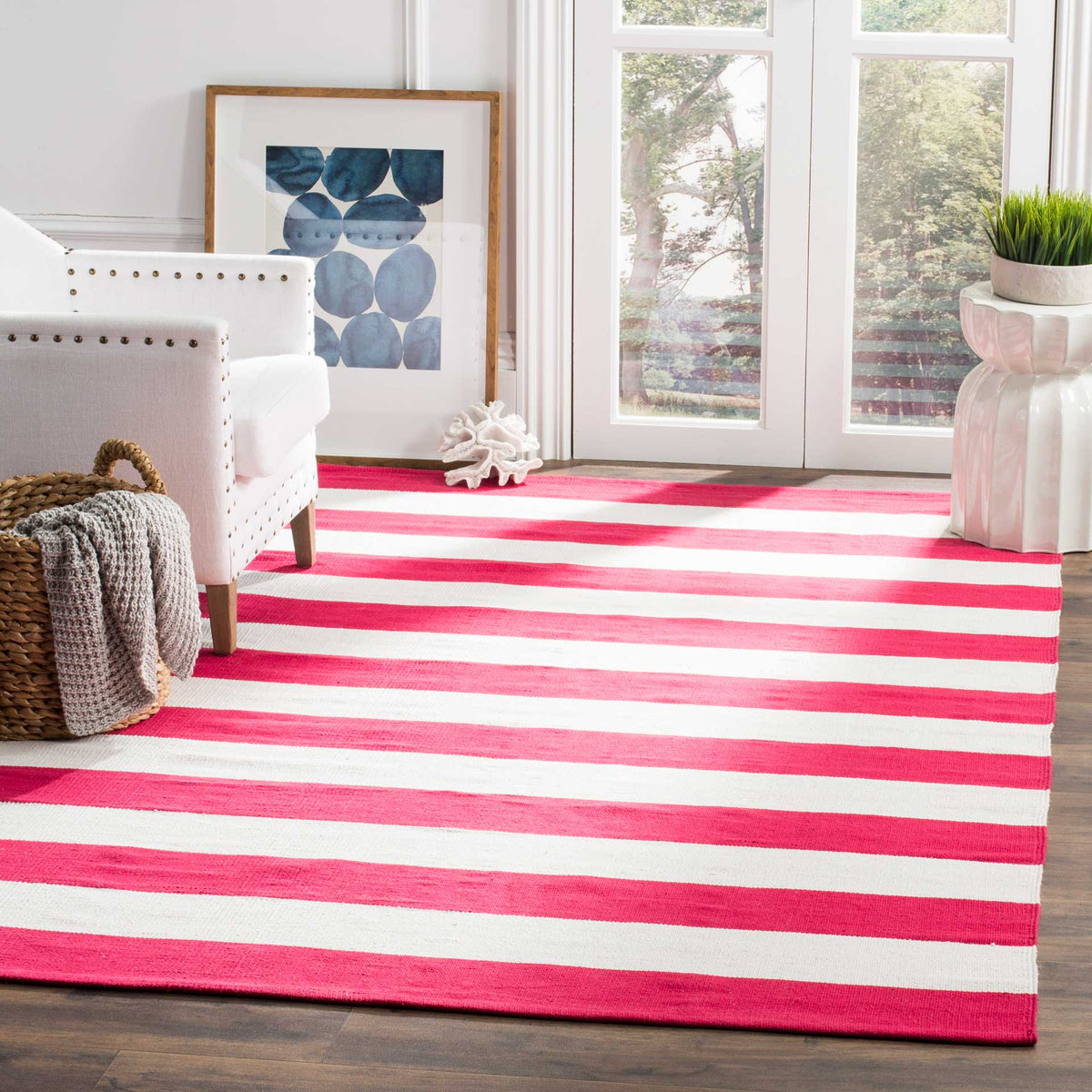 Striking red and ivory stripes add a spirited focal point to a bright living room.