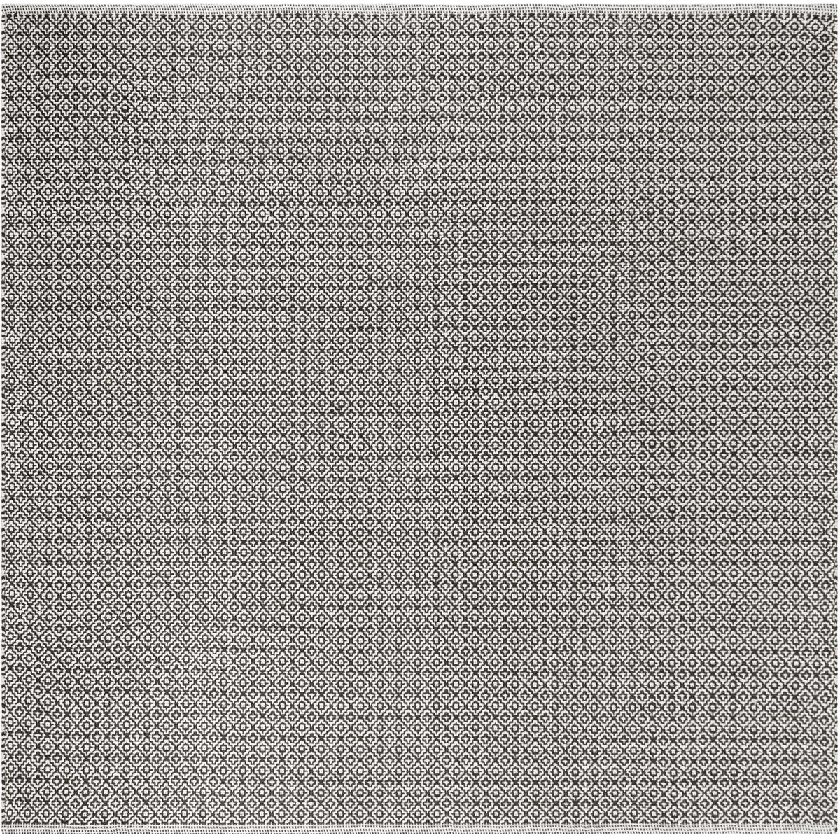 This square ivory and black cotton rug features intricate diamonds from edge to edge.