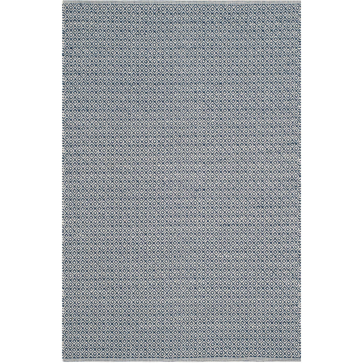 Navy and ivory threads create a bold, tightly repeated motif on this rectangular rug.