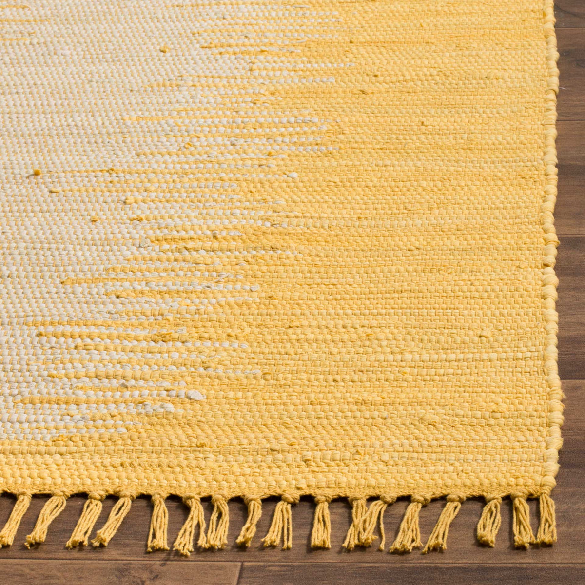 Textured gold and cream cotton weave ends in a tidy edge and loose fringe