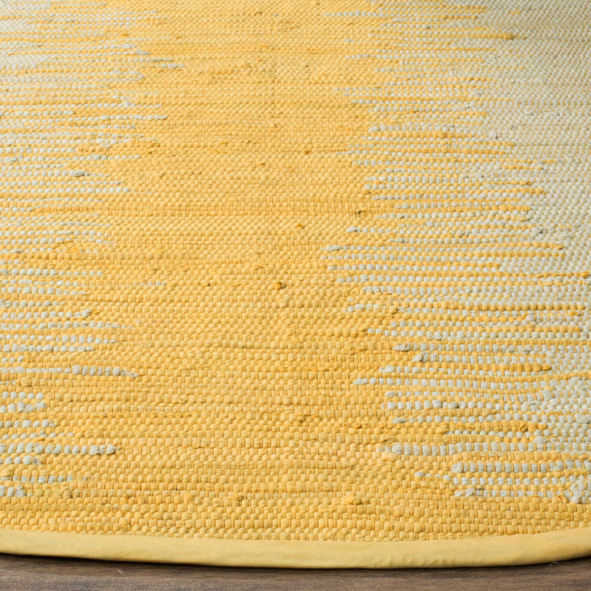 Gold and ivory yarns create a textured weave with neat fabric binding