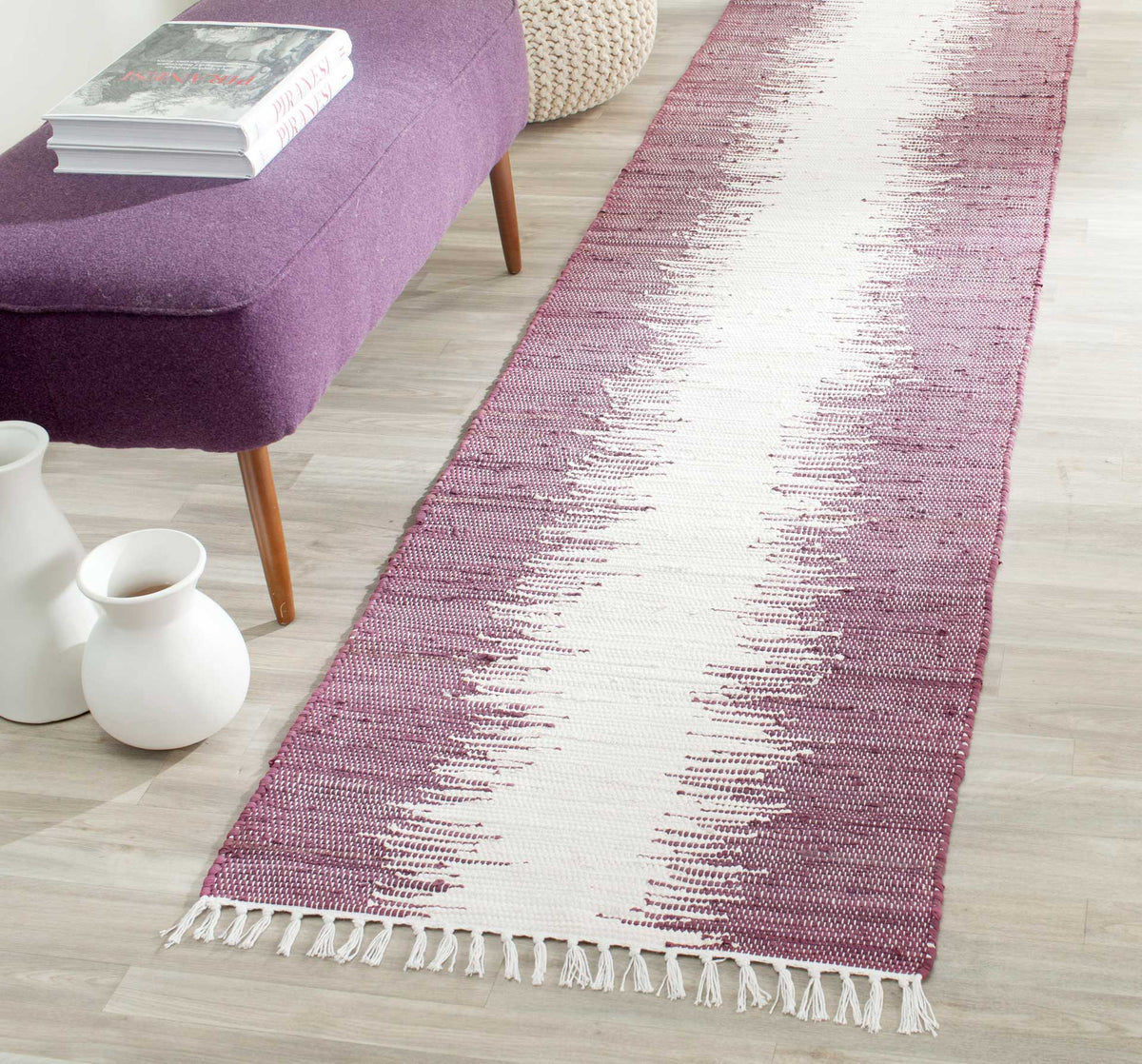 Purple and ivory runner adds color with feathered stripe edges and white fringe