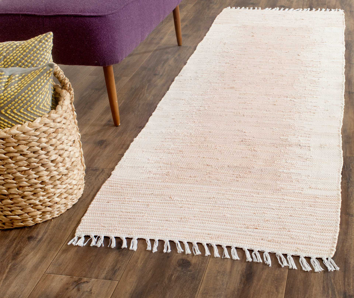 Subtly striped beige cotton runner brings natural texture beside a sofa