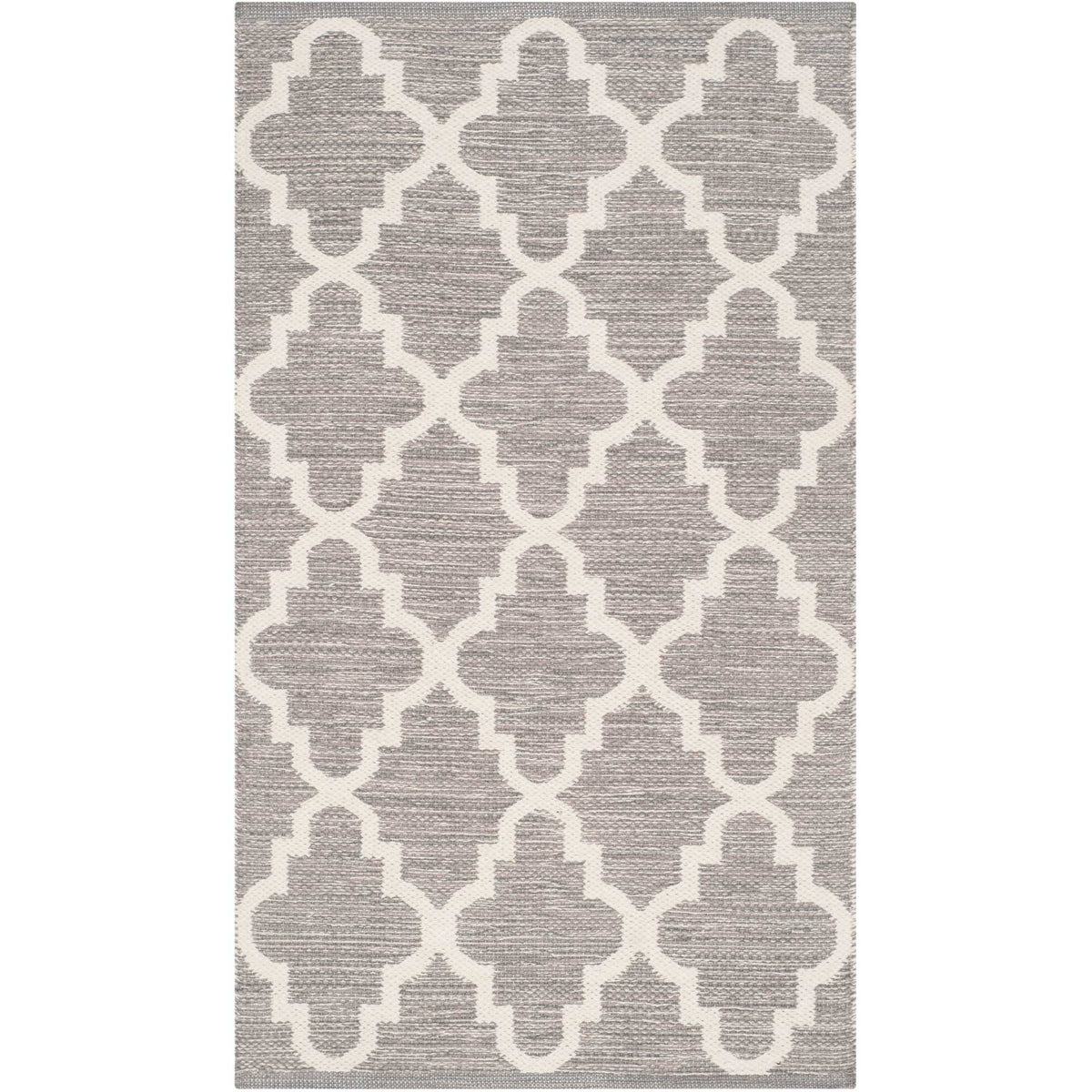 A compact gray and ivory rug makes a charming accent with generously scaled quatrefoils.