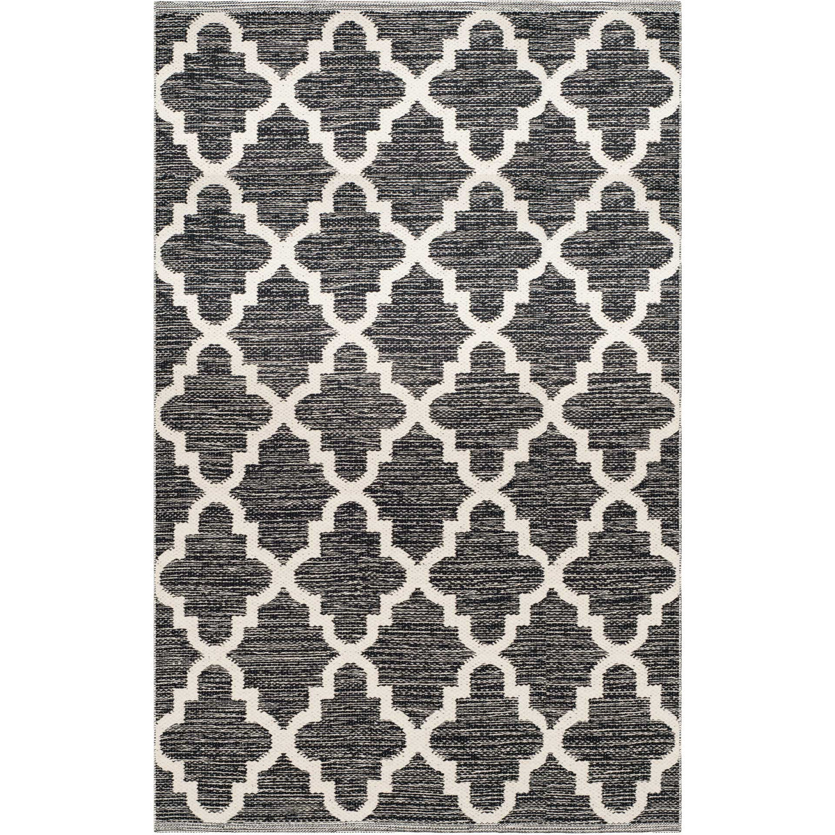 A 3' x 5' black and ivory rug makes a striking accent with large quatrefoil outlines.