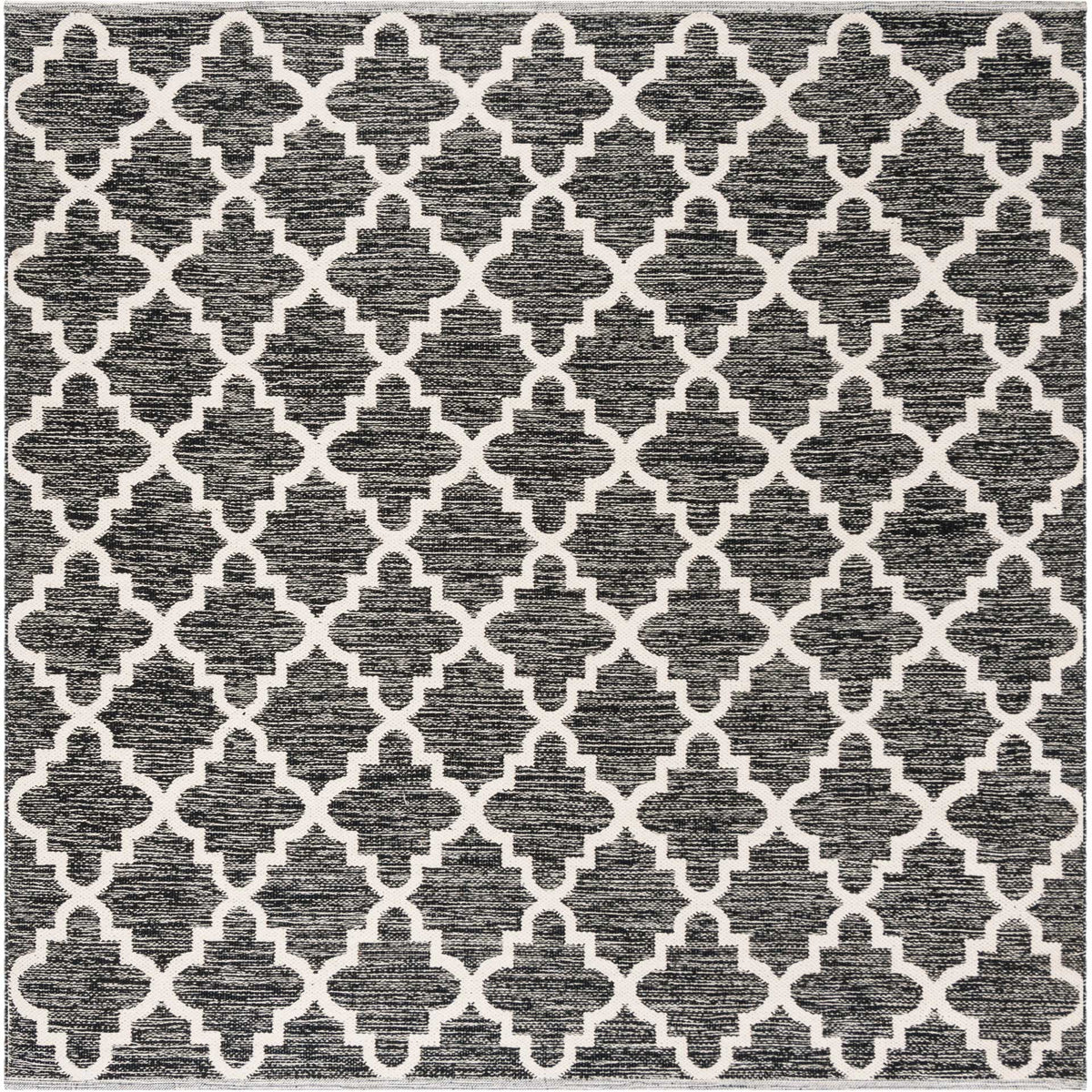 A 6' square black and ivory rug makes the geometric quatrefoil pattern feel crisp and balanced.