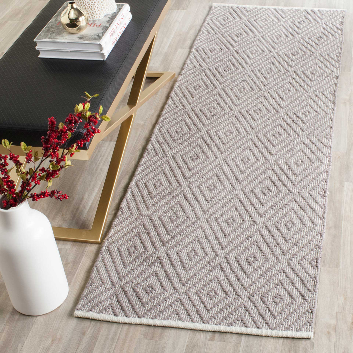 Neutral gray and ivory diamonds lend a calm, tailored look to a narrow floor space.