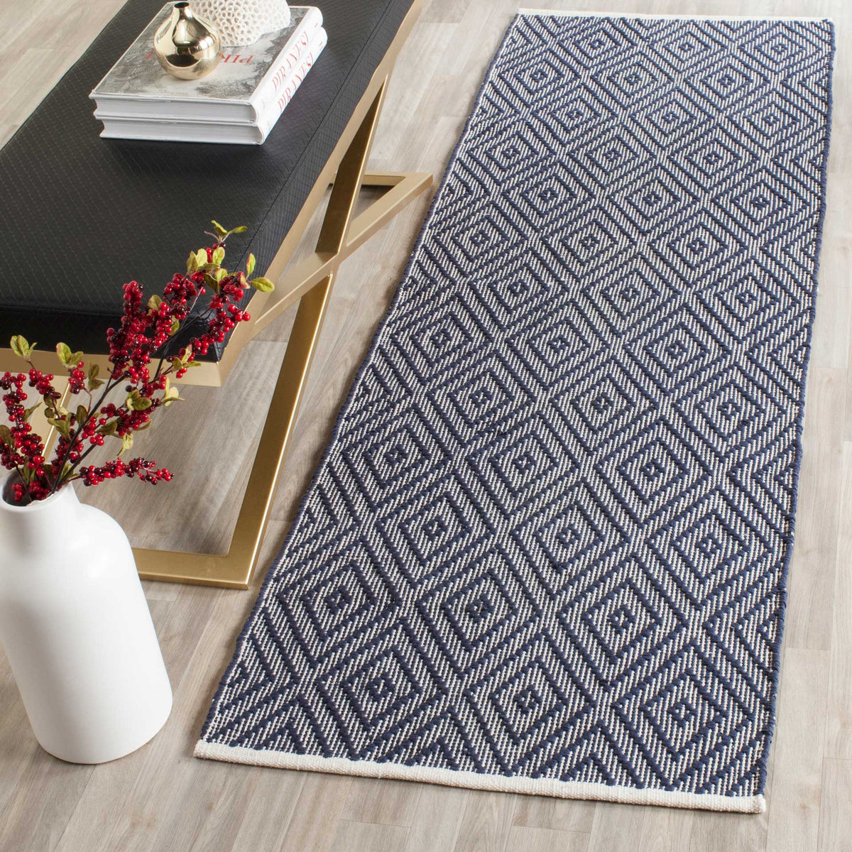 High-contrast navy diamonds add graphic depth and rich texture to a narrow floor space.
