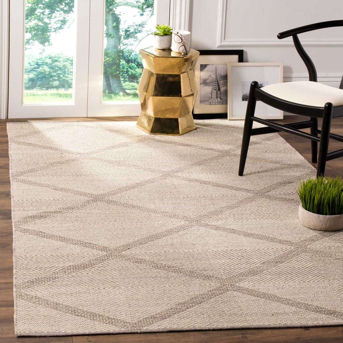 Soft gray diamonds lend subtle pattern to a woven rug beneath contemporary furniture.