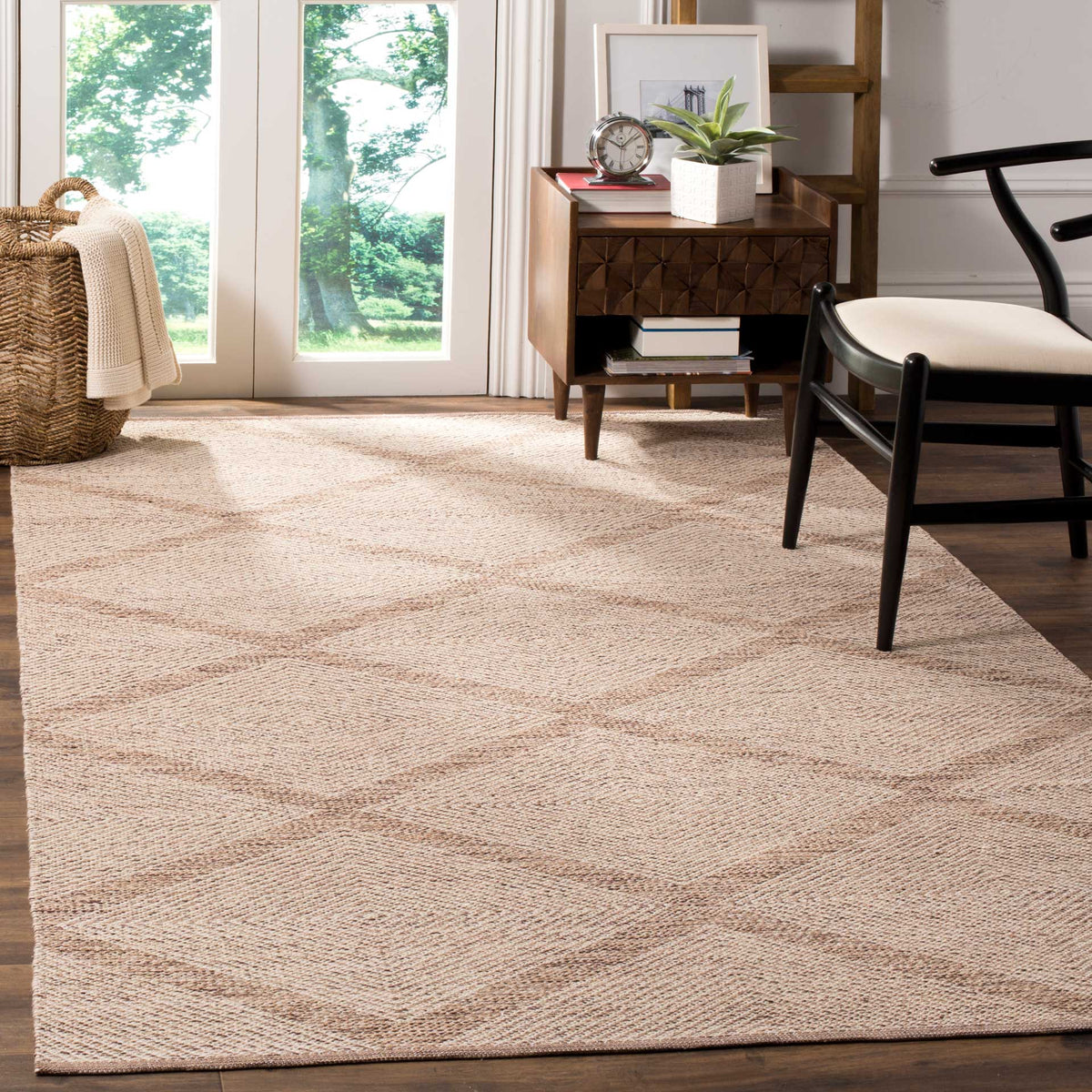 A beige diamond-patterned rug adds a warm, woven foundation to a bright living space.