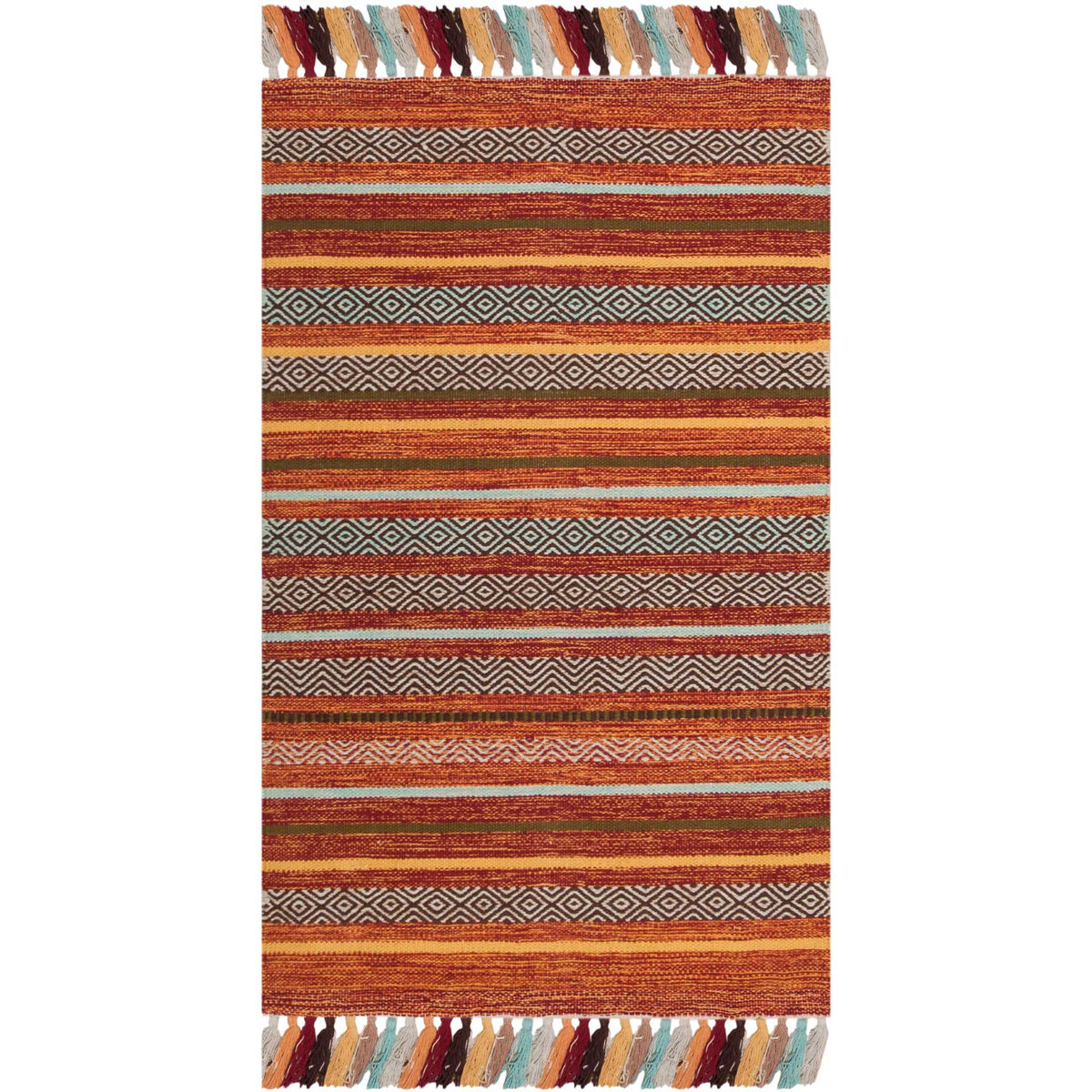 Small rust-red rug with cream zigzags, dark stripes, and colorful tasseled trim.
