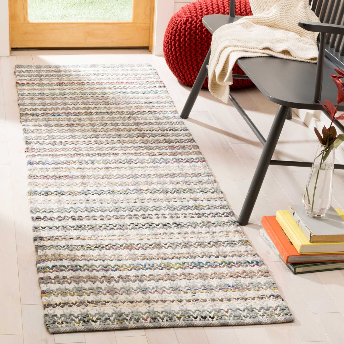 Soft gray and colorful stripes bring casual warmth to this entryway runner
