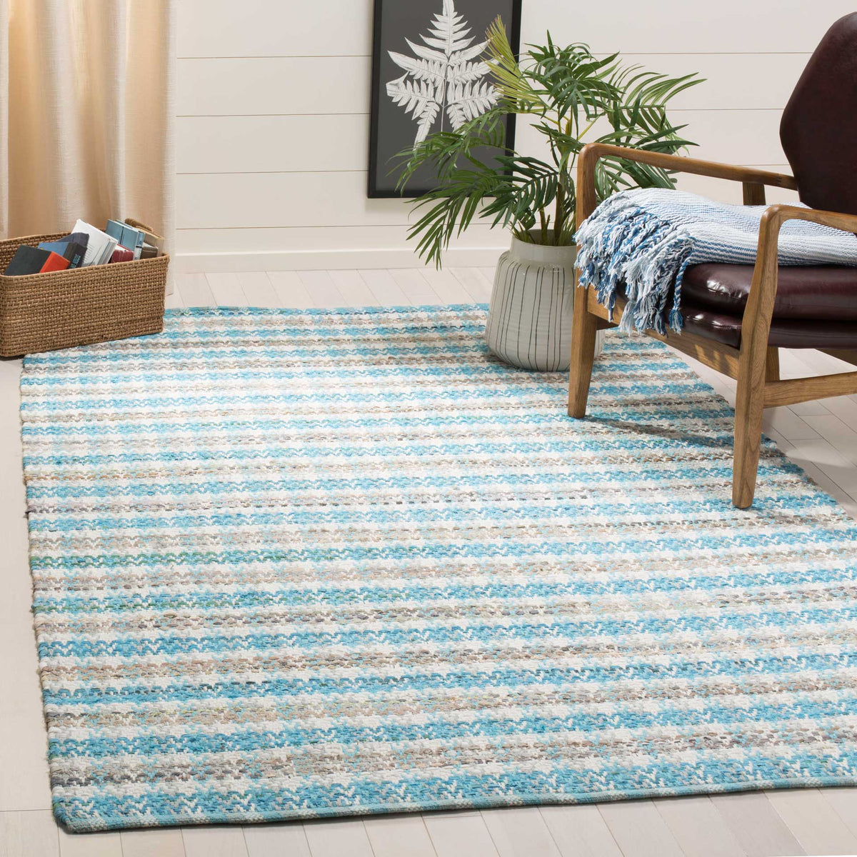 Aqua-striped cotton rug adds fresh color and soft texture to a relaxed seating space.
