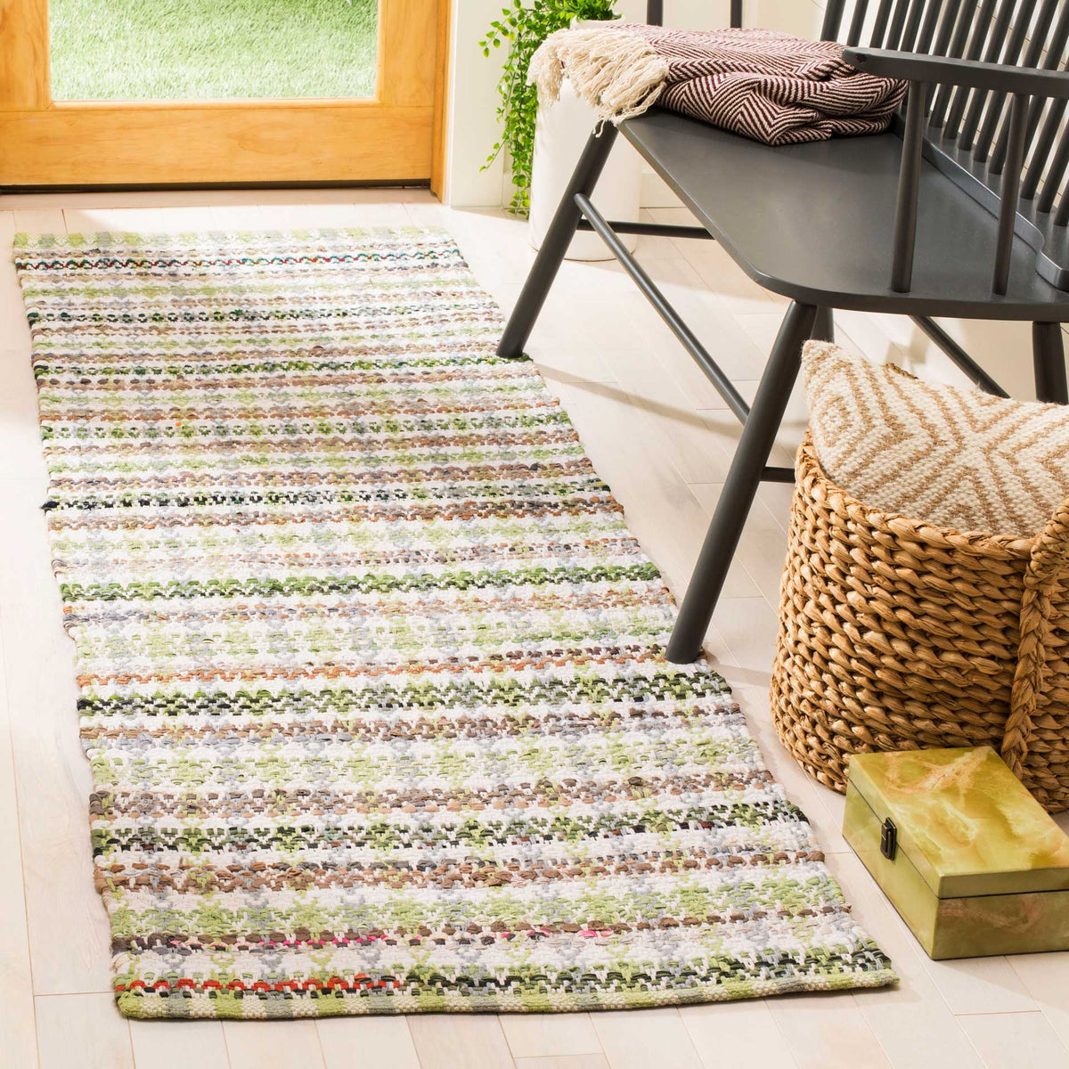 Fresh green and multicolored stripes add playful warmth to this hallway runner
