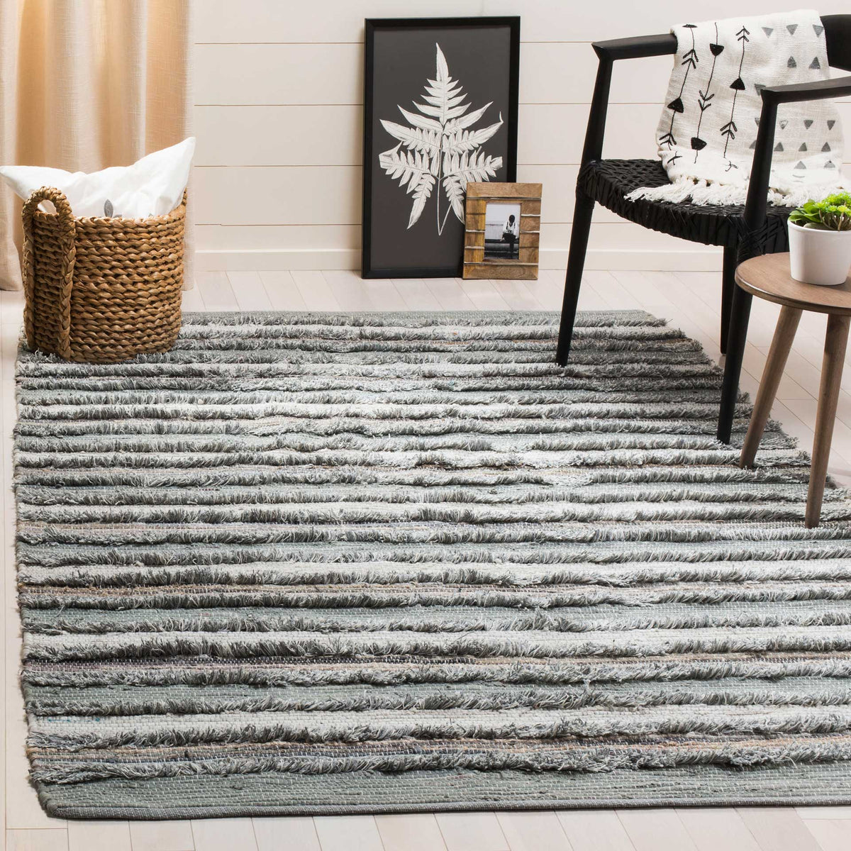Soft gray and white stripes bring handwoven texture and a calm finish to the floor.