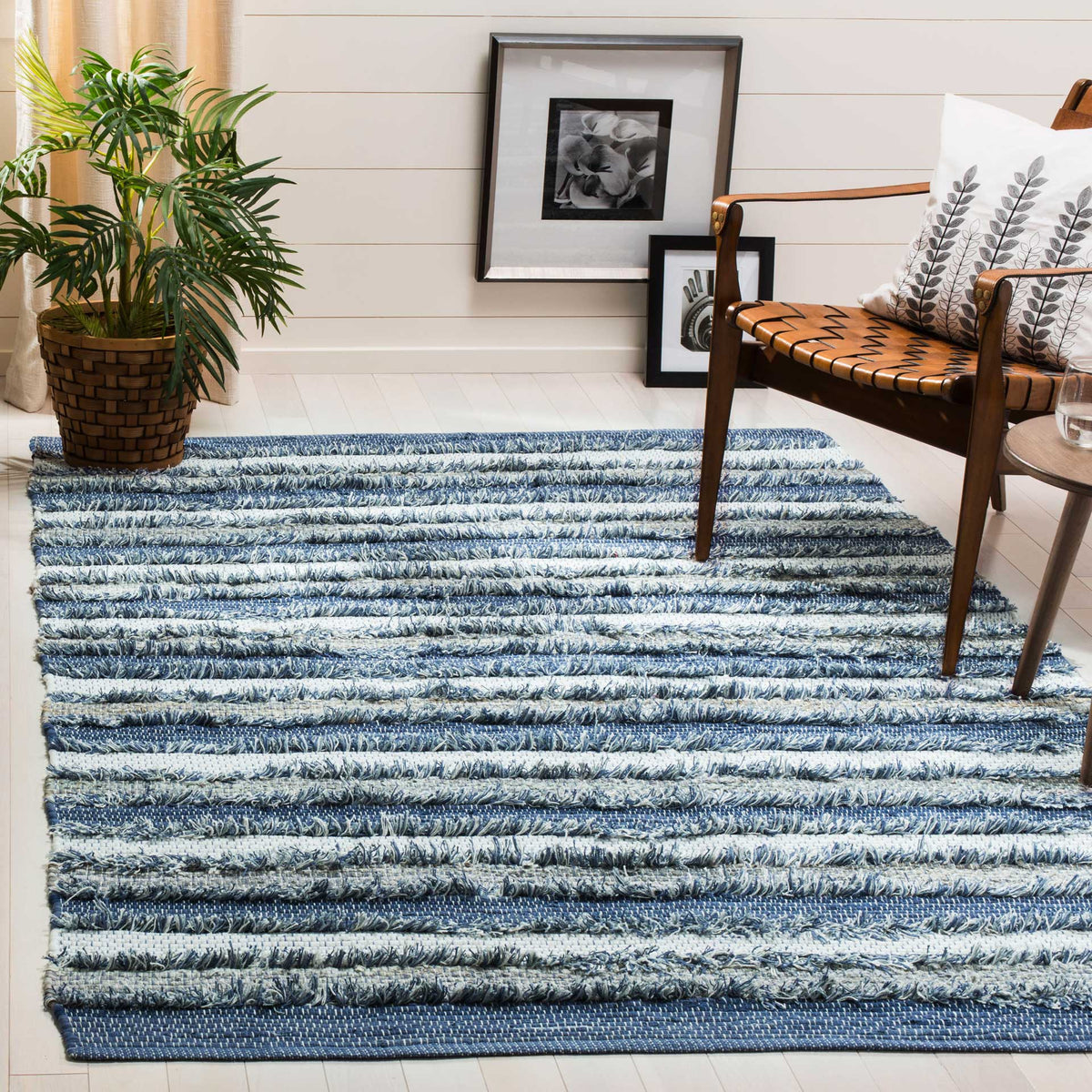Blue and cream cotton stripes add a fresh, textured foundation to a seating area.
