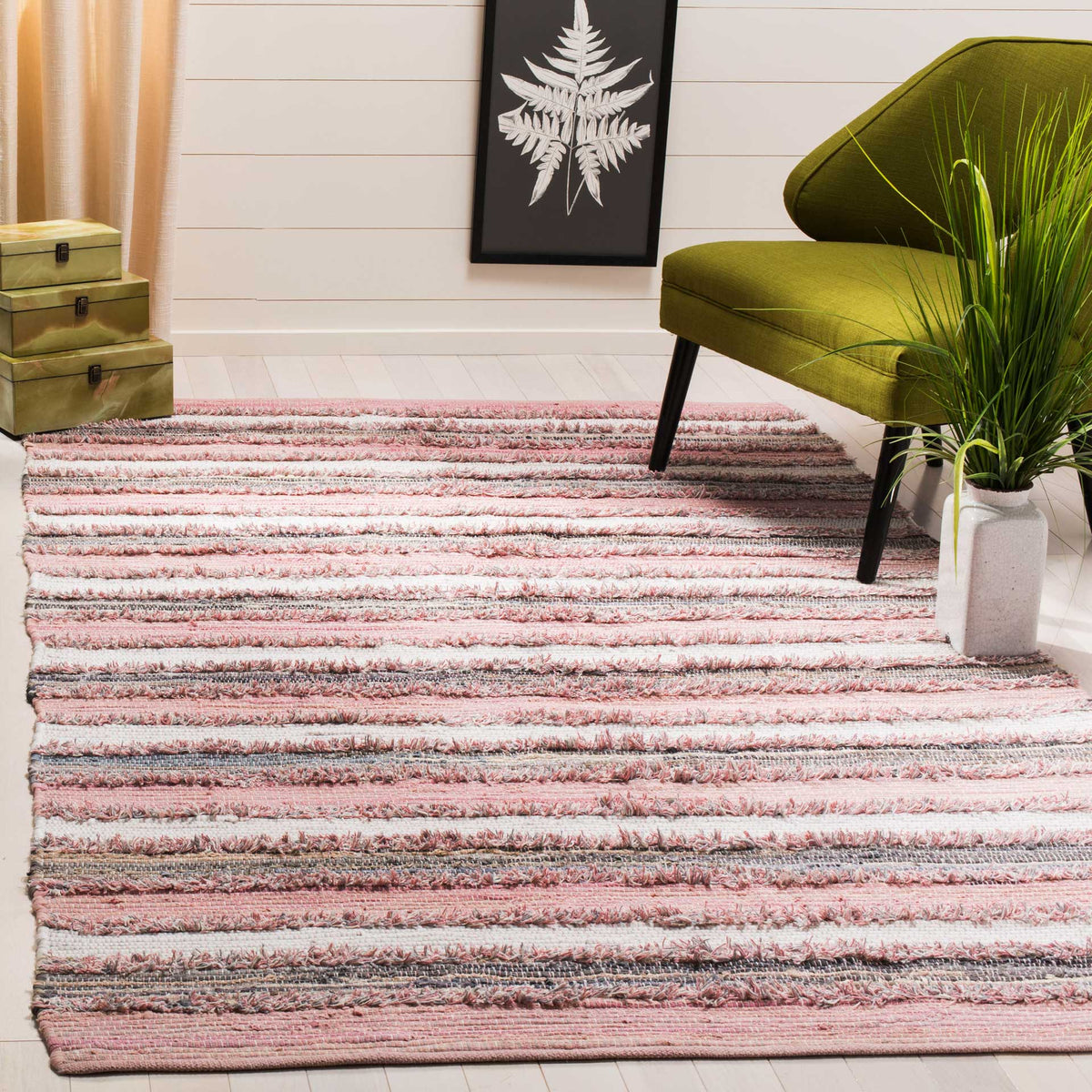 Blush and ivory stripes bring a soft pop of color and inviting texture to the floor.