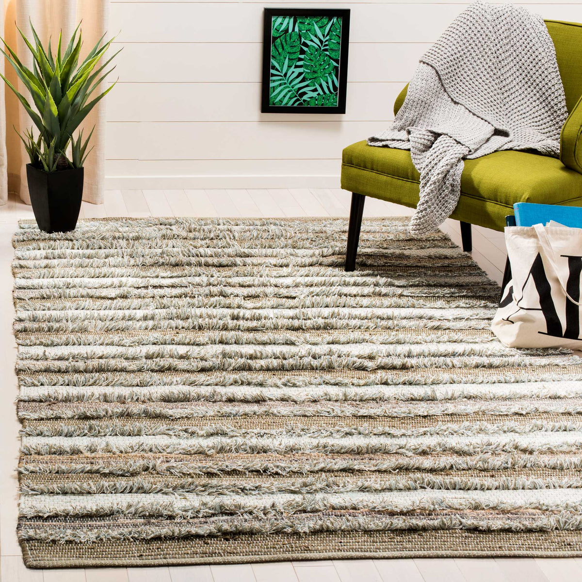 Warm beige and ivory cotton stripes ground a cozy seating area with inviting texture.