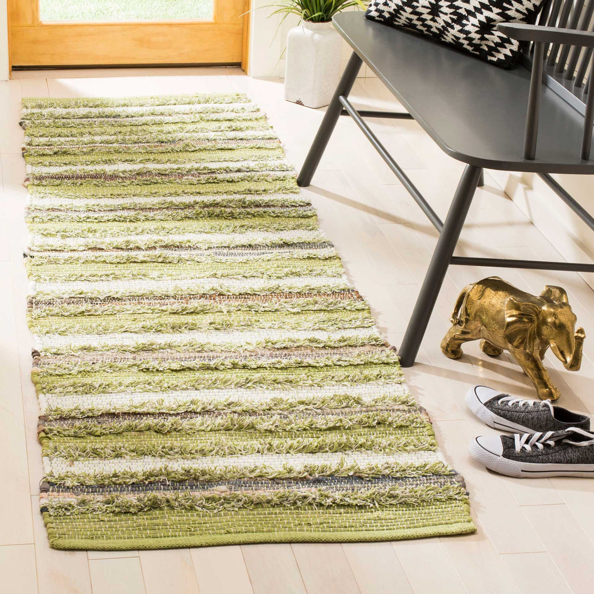 Soft sage and cream stripes give this textured runner an easygoing, natural feel.