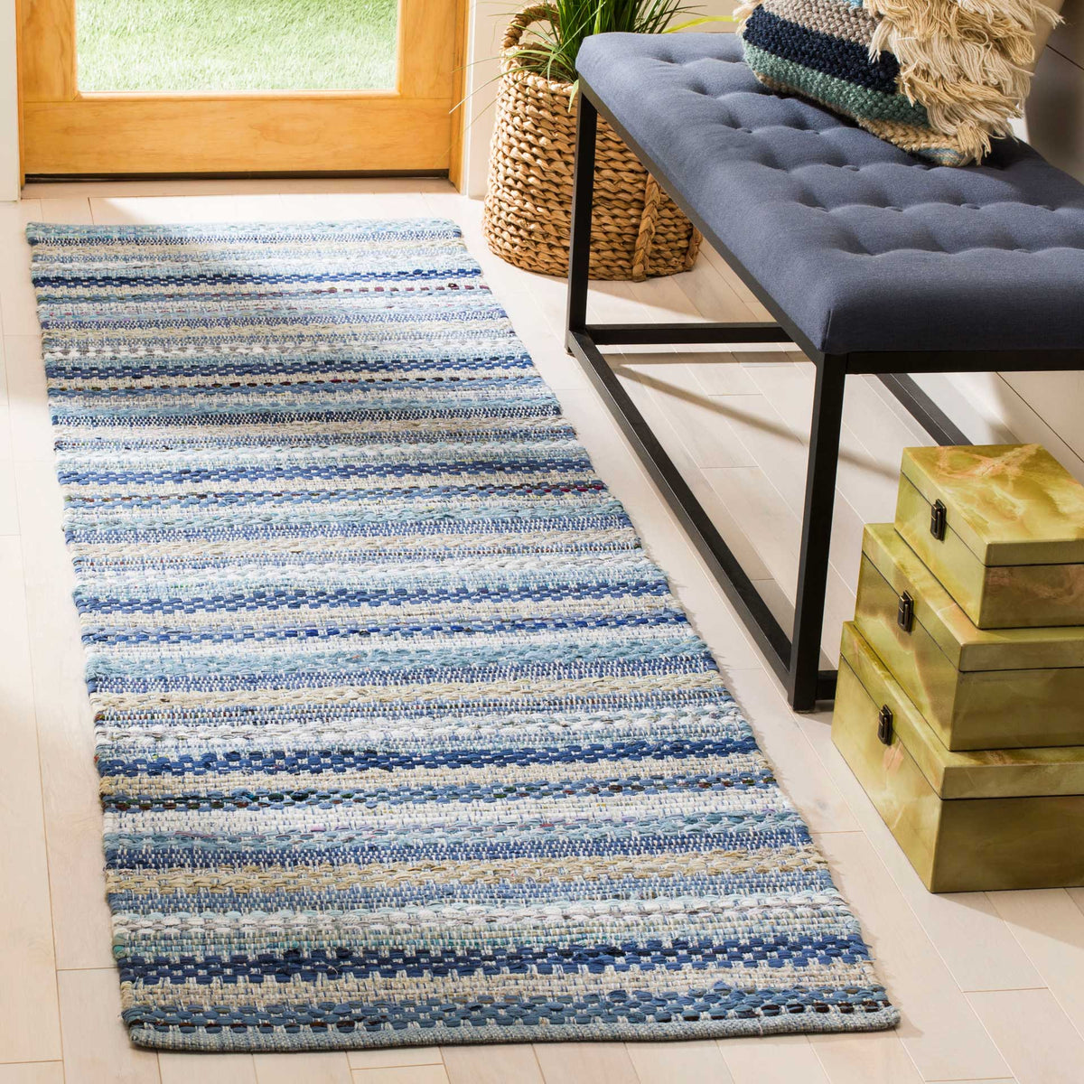Layered blue stripes add relaxed color and texture to a bright entryway