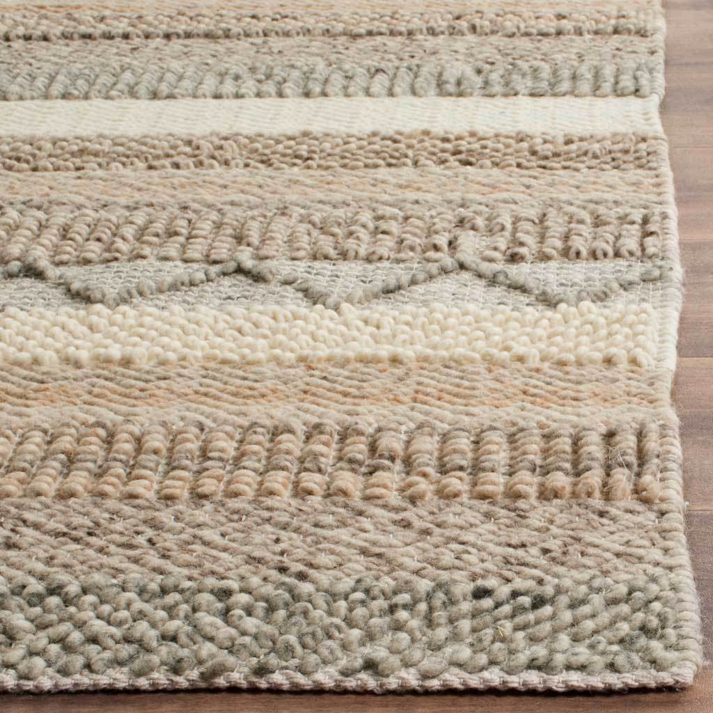 Chunky wool-and-cotton loops mingle with smooth cream bands and delicate woven zigzags.