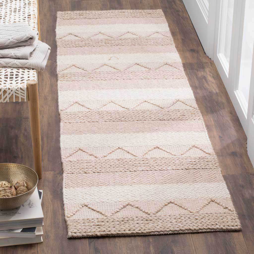 Raised zigzag accents lend texture to a softly striped beige hallway runner