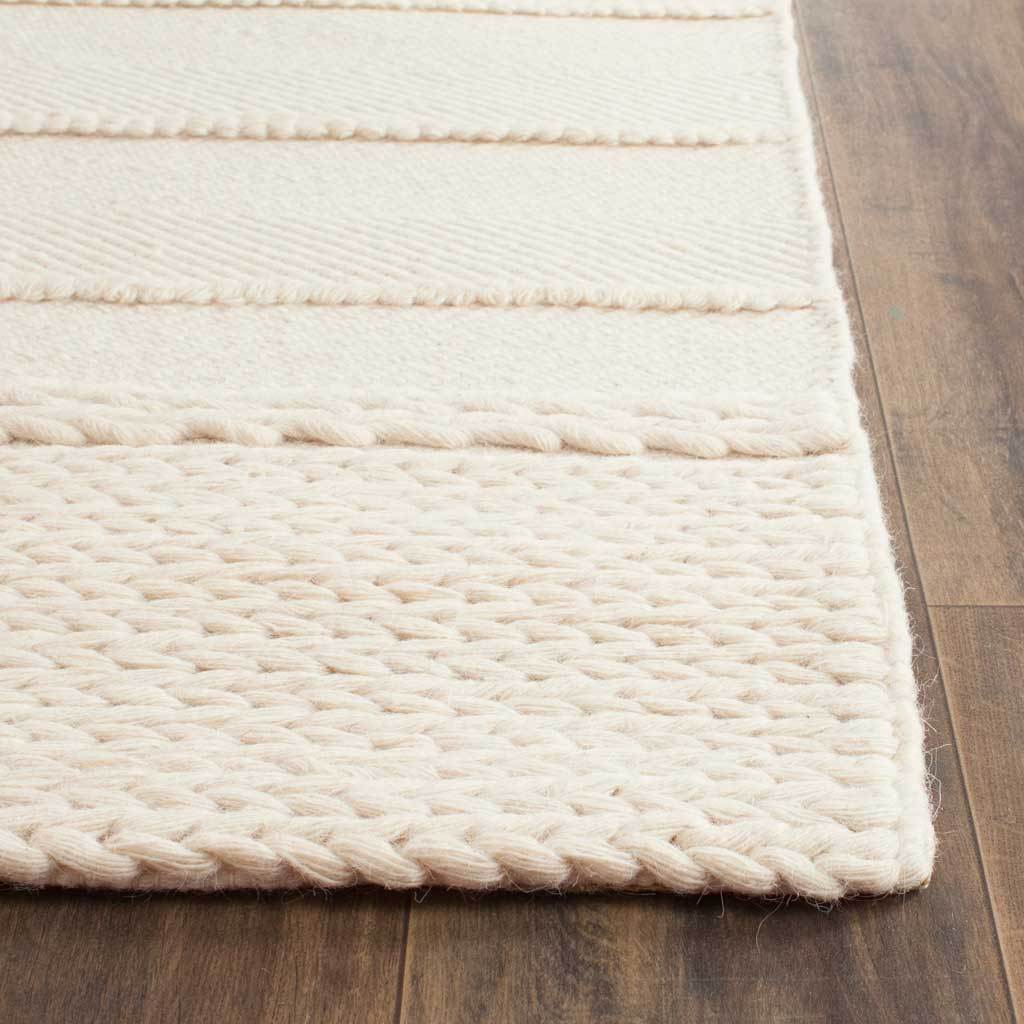 Chunky woven loops and a neatly finished edge add texture to the natural runner