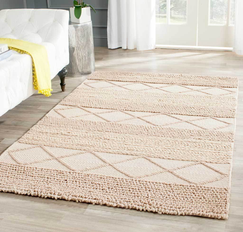 Beige wool-cotton rug combines plush looped rows and oversized ivory diamonds