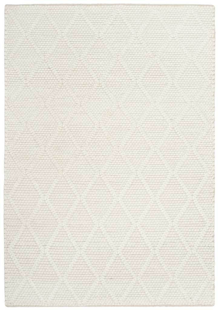 Subtle raised diamonds lend dimension to this ivory rug's tactile weave.