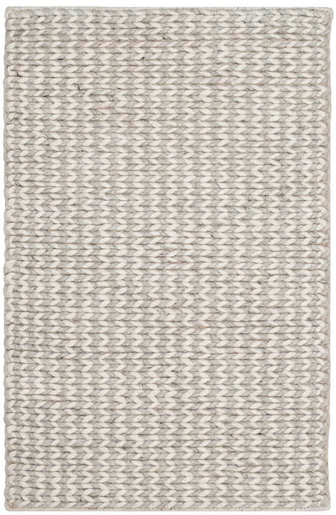 A petite ivory and silver accent rug showcases chunky woven yarns and neatly finished edges.