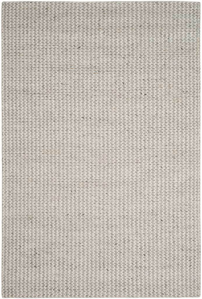 An ivory and silver rectangular rug brings dimension to the floor with its textured weave.