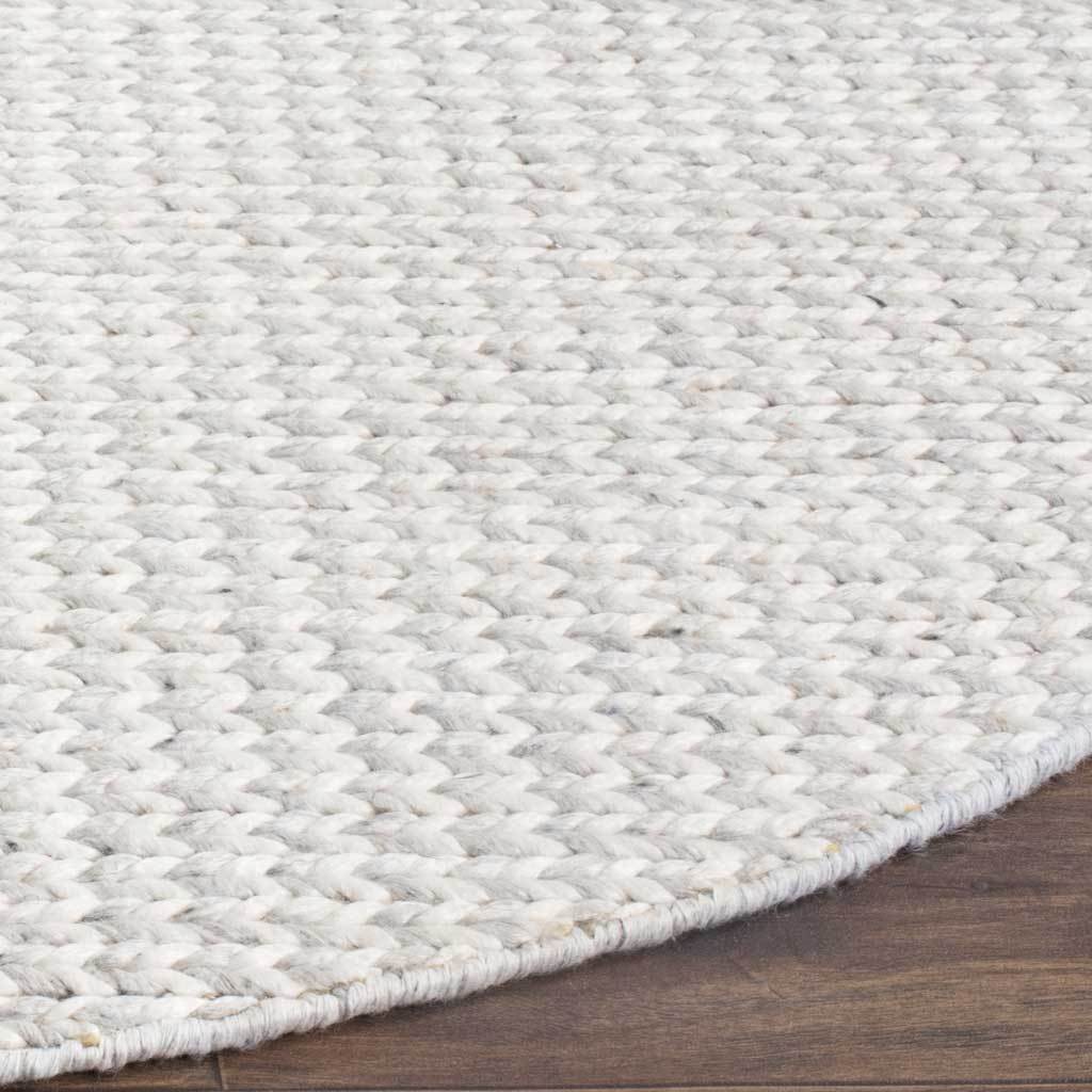 Chunky ivory and silver weave meets a neatly finished curved edge