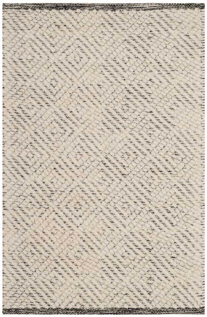 An ivory 2' x 3' rug adds inviting texture with light gray diamonds and raised loops.