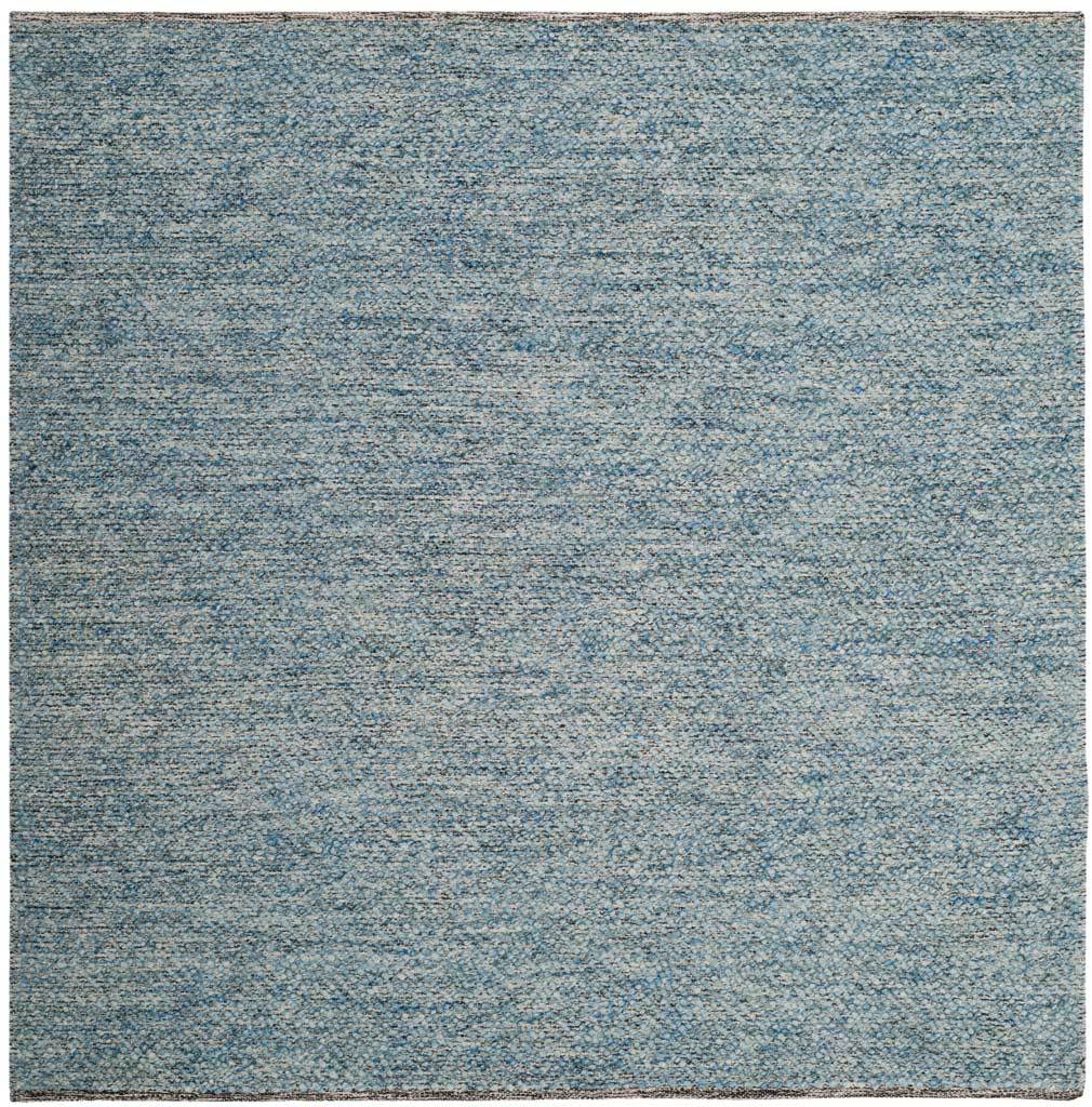 A 6' square blue rug brings balanced proportions and a softly flecked woven texture.