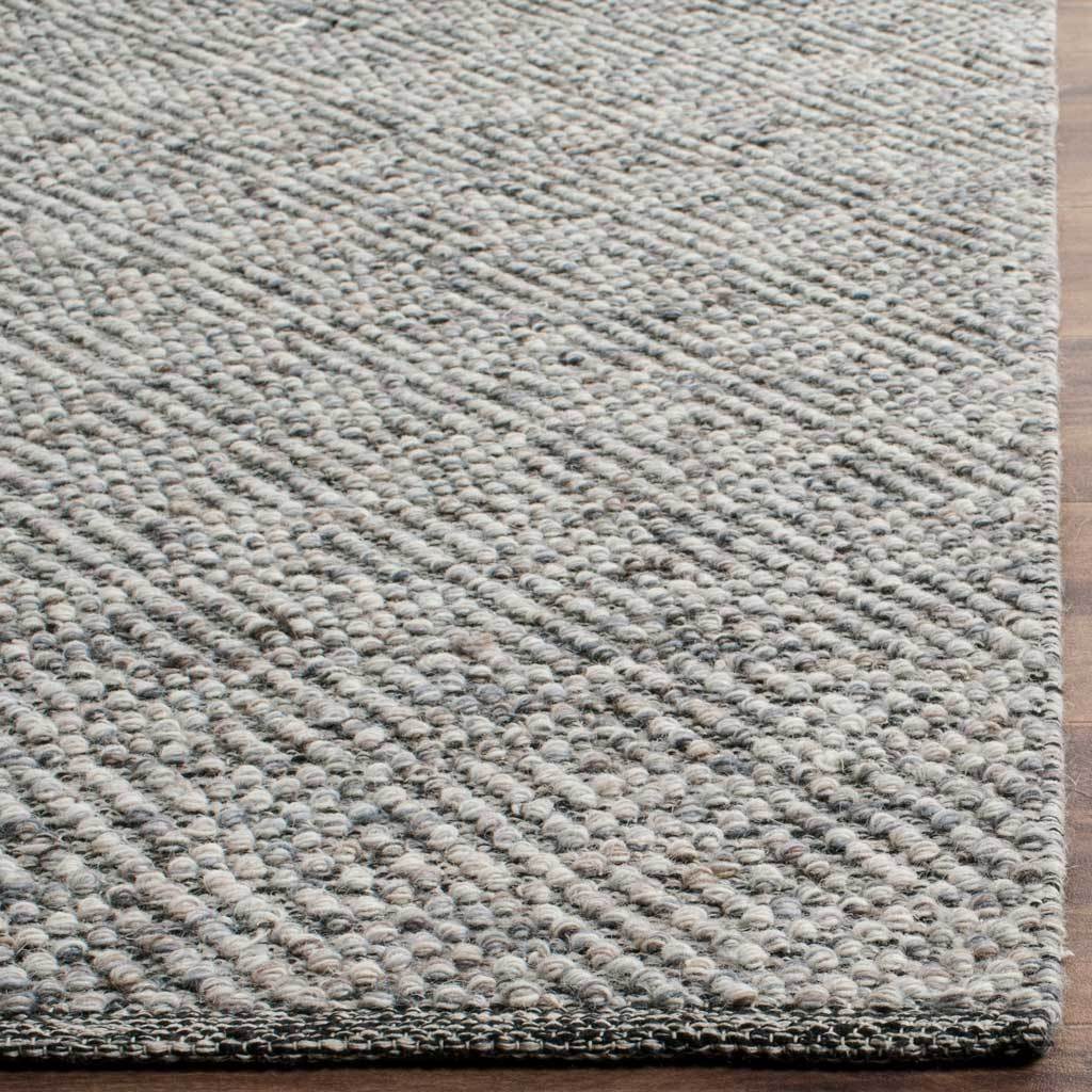 Textured loops of camel and gray yarn end in a neat, hand-finished border.