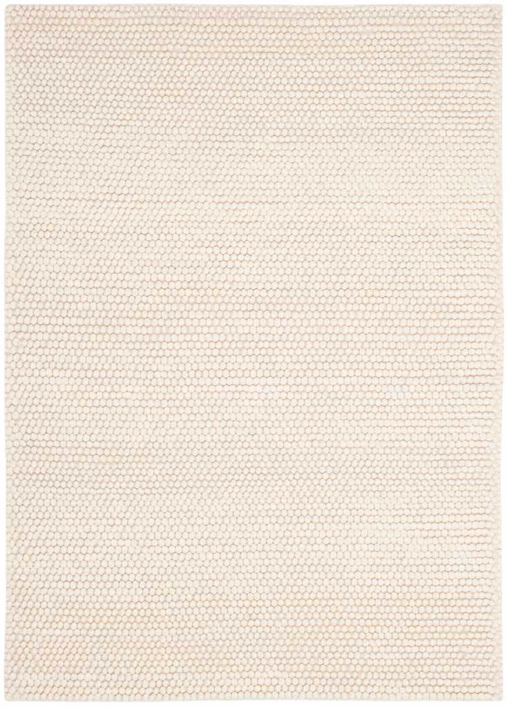 An ivory 4-by-6-foot rug adds understated warmth through rows of nubby woven texture