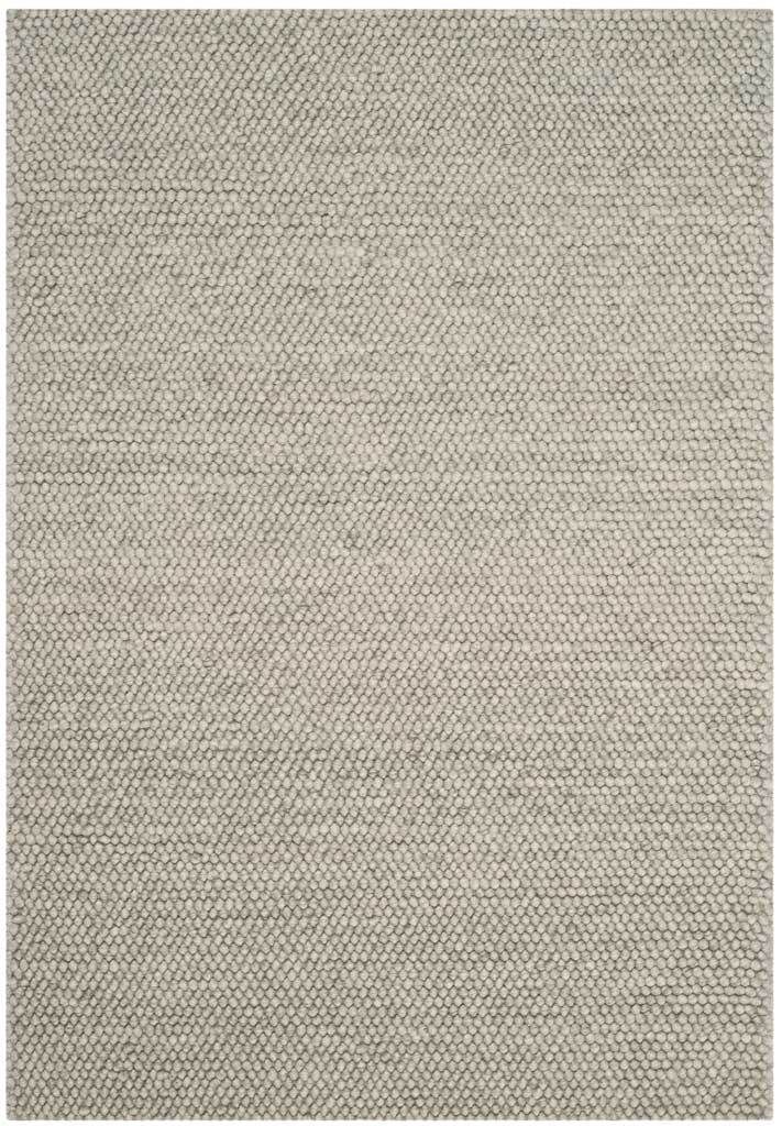 A 4-by-6-foot silver-gray rug adds quiet dimension with a fine, even woven texture